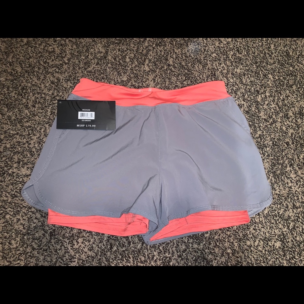 Salmon and grey athletic and grey shorts